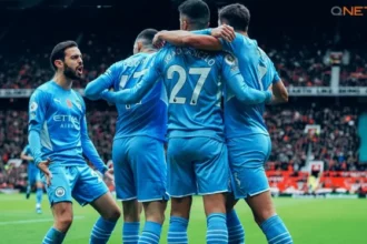 Manchester City players celebrating a goal in the Premier League 2021 22 Campaign