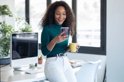African female entrepreneur looking at her phone