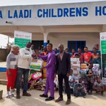 QNET giving a donation to the Mama Laadi Oprhanage in Ghana