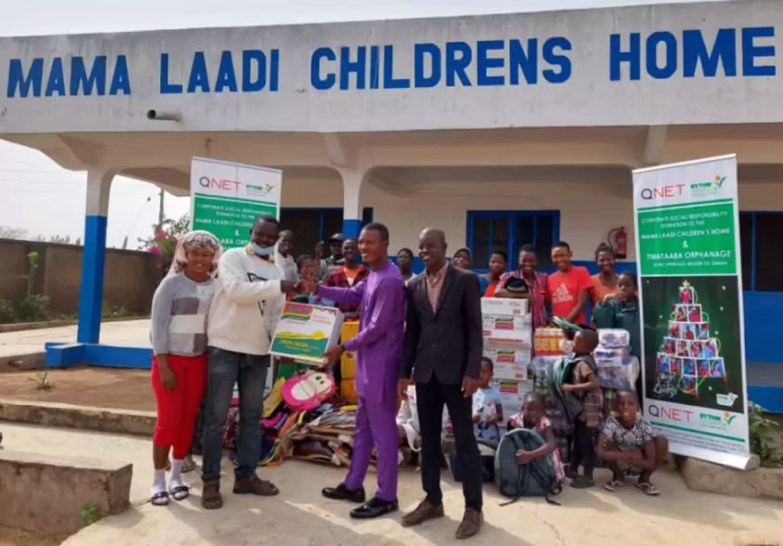 QNET giving a donation to the Mama Laadi Oprhanage in Ghana