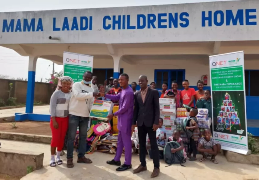 QNET giving a donation to the Mama Laadi Oprhanage in Ghana