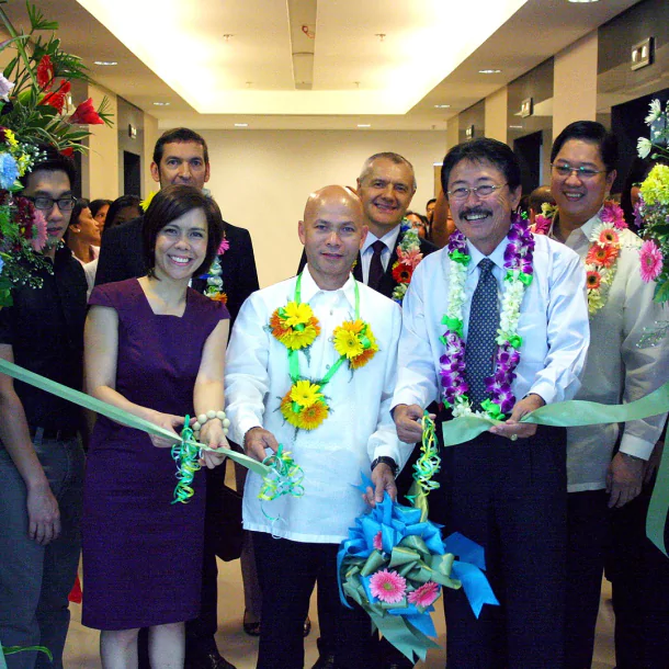 QNET with philippines office campus cutting ribbon