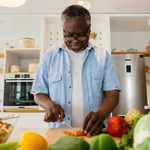 African man preparing a plant-based meal