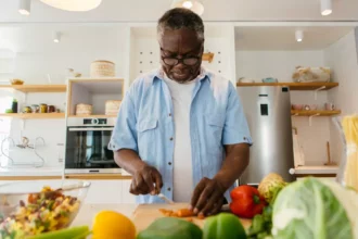 African man preparing a plant-based meal