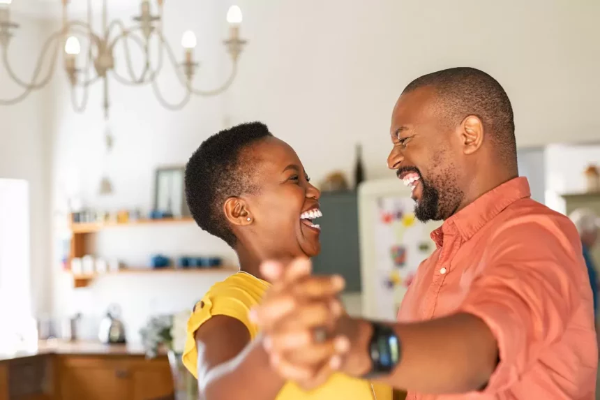 African man and woman celebrating Valentine's day after receiving QNET products