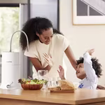 Mother and son drinking HomePure Nova filtered water