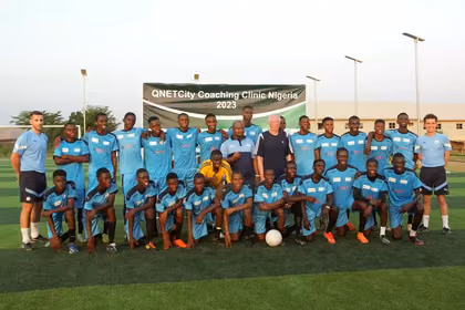 Football players posing at the QNET Manchester City football clinic in Nigeria