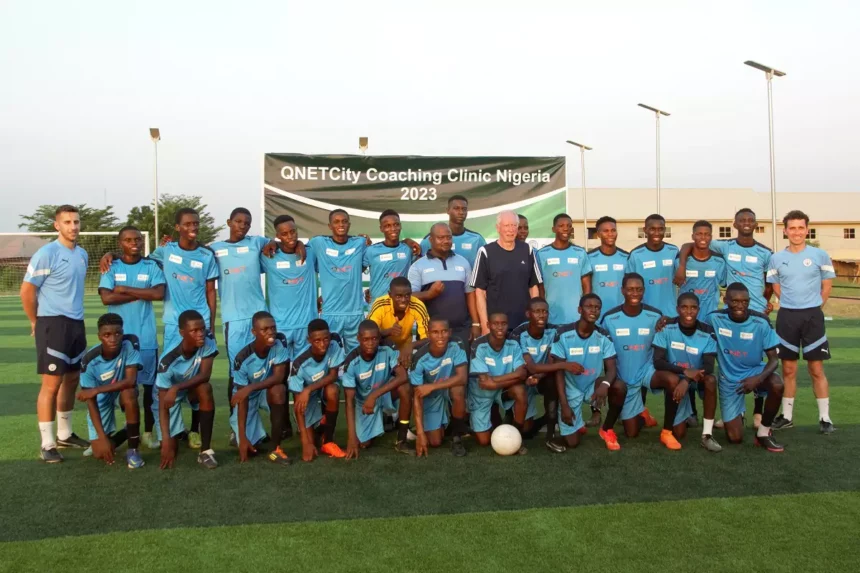 Football players posing at the QNET Manchester City football clinic in Nigeria