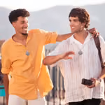 Two guys wearing QNET's Chi Pendant 4