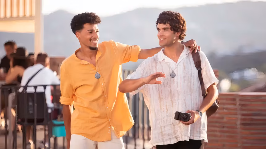 Two guys wearing QNET's Chi Pendant 4