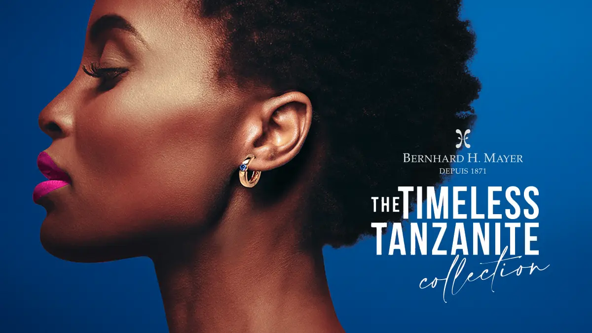 African model with short hair wearing an earring from Bernhard H. Mayer Timeless Tanzanite Collection of QNET Jewellery