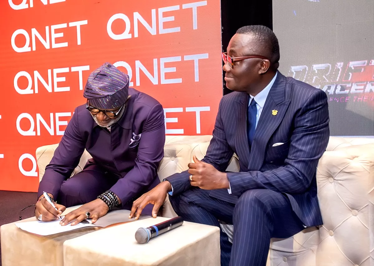 Bola Ray signing at QNET event in Ghana