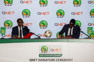 Representatives from CAF an QNET signing the renewal of the partnership in 2025